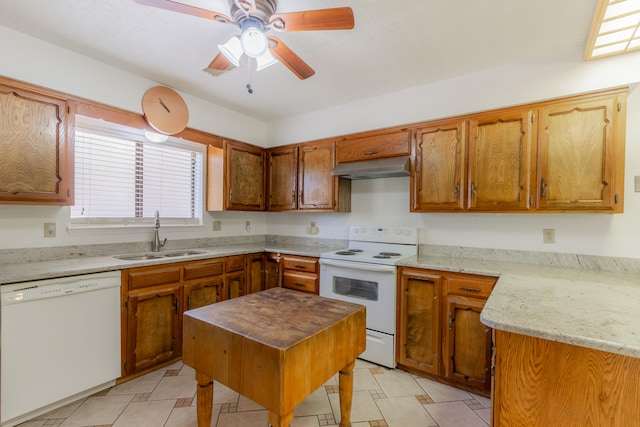 kitchen featuring ceiling fan, light stone counters, sink, and white appliances