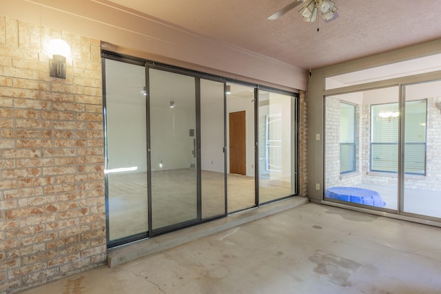 interior space featuring ceiling fan