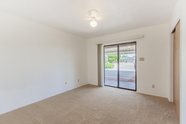 empty room featuring light colored carpet