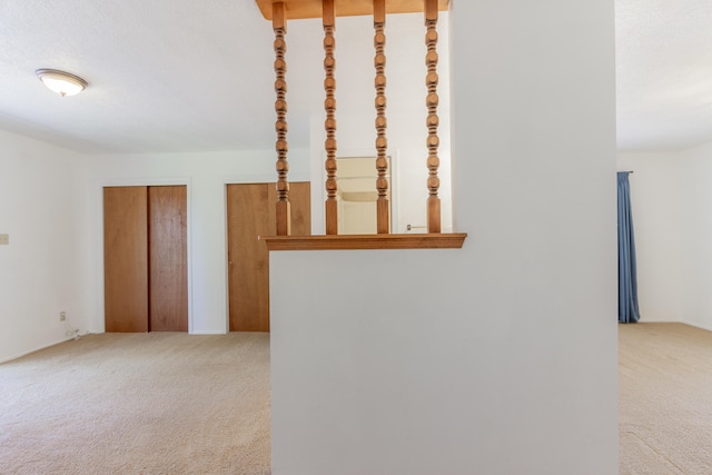 stairs featuring carpet flooring