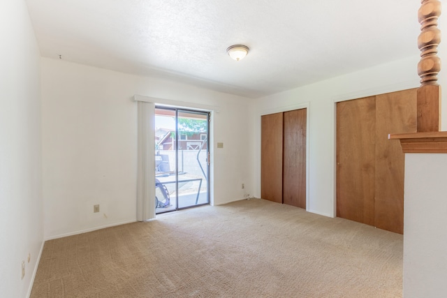 empty room featuring light carpet