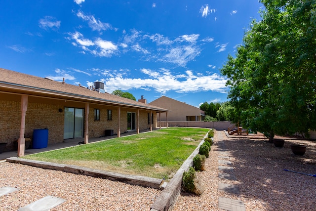 view of yard featuring a playground and a patio area