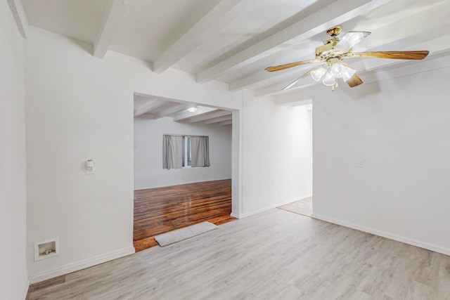 spare room with beamed ceiling, light hardwood / wood-style flooring, and ceiling fan