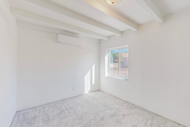 carpeted spare room with beam ceiling and an AC wall unit