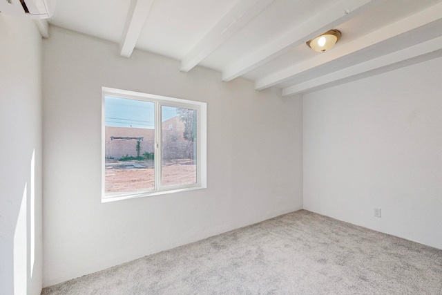 unfurnished room with light carpet, beam ceiling, and a wall unit AC