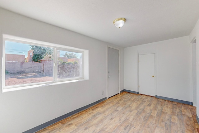 unfurnished room featuring light hardwood / wood-style flooring