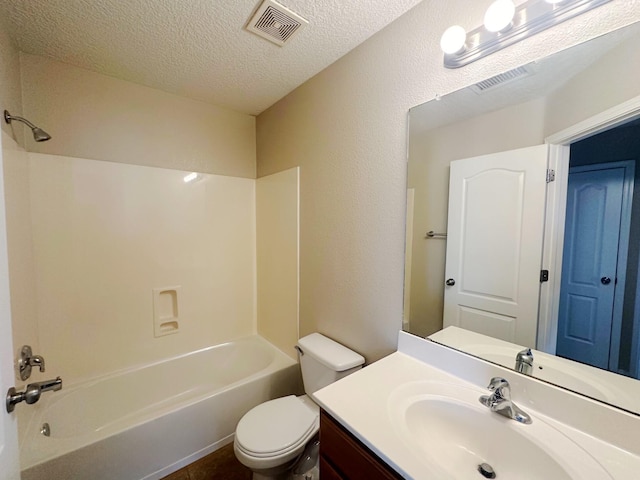 full bathroom featuring a textured ceiling, vanity, toilet, and shower / bathing tub combination