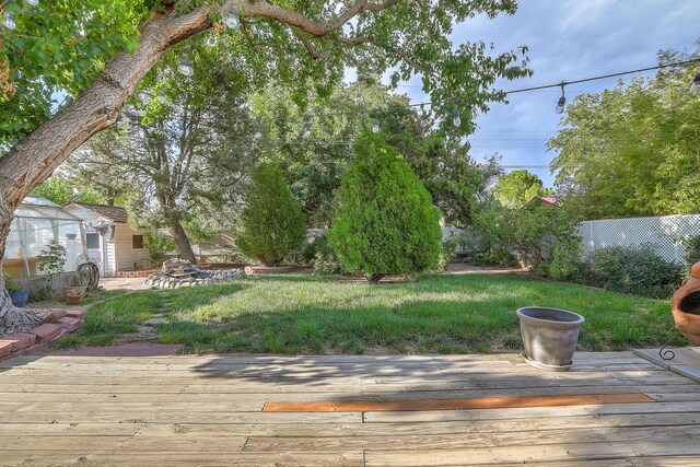 view of yard featuring a wooden deck