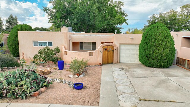 southwest-style home with a garage