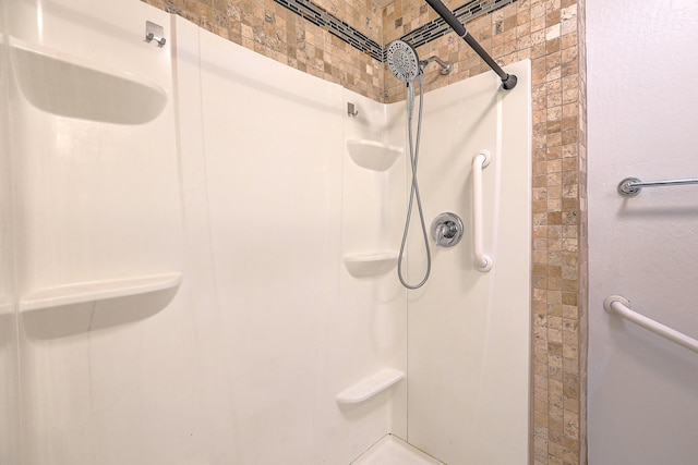 bathroom featuring a shower stall