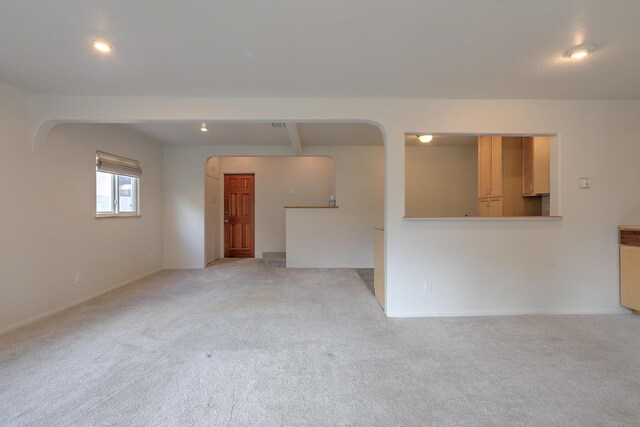 empty room featuring light colored carpet