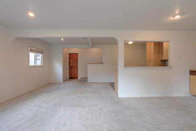 unfurnished room with light colored carpet