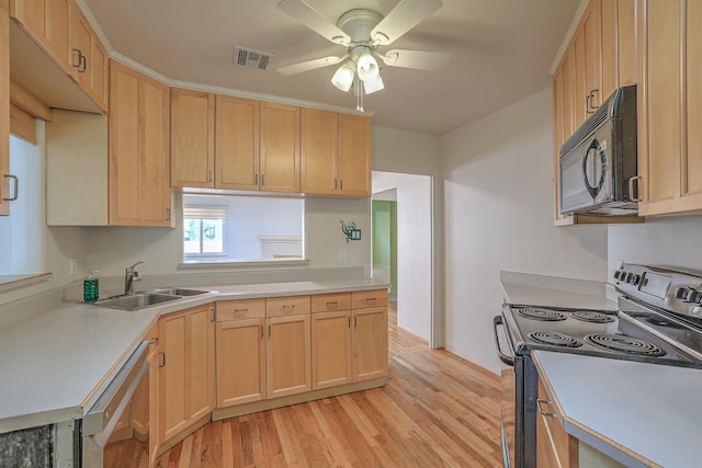 kitchen featuring dishwasher, light hardwood / wood-style floors, stainless steel range with electric cooktop, and light brown cabinets