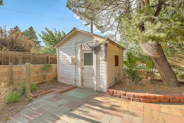 view of shed featuring a fenced backyard