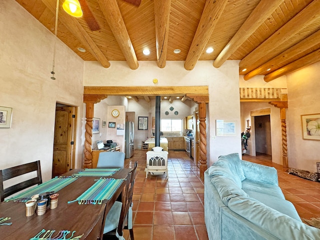 living room with wooden ceiling, beamed ceiling, and tile patterned floors