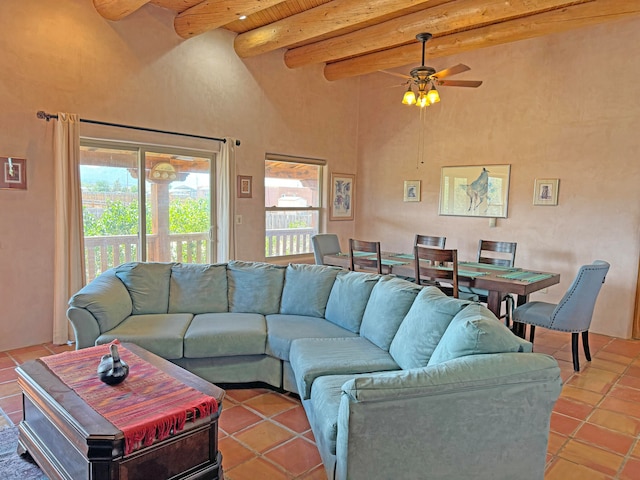 tiled living room with wood ceiling, ceiling fan, high vaulted ceiling, and beam ceiling