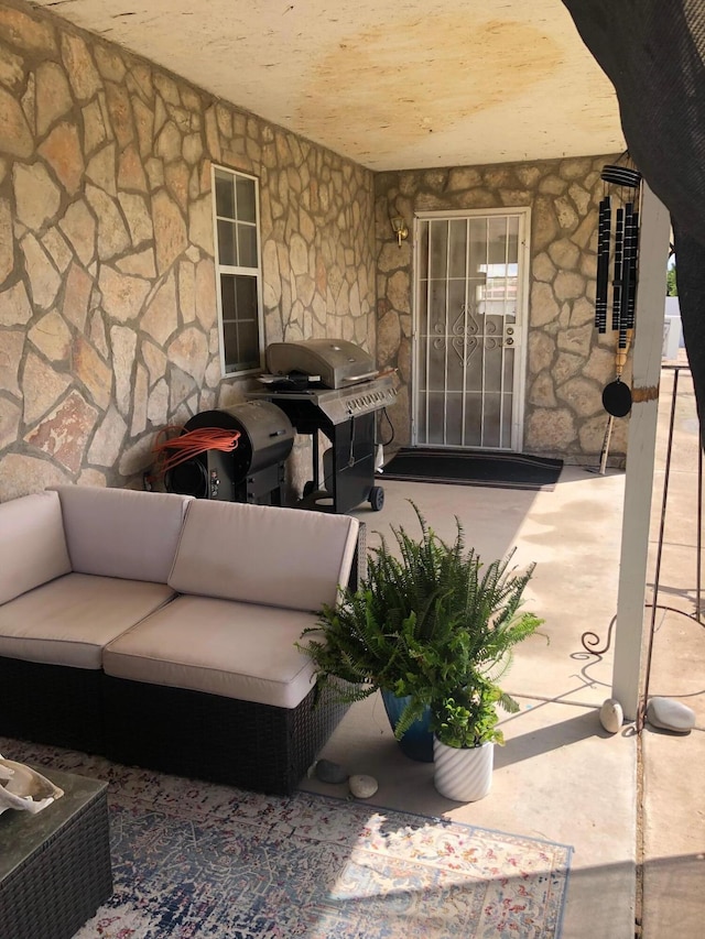 view of patio / terrace featuring an outdoor living space and a grill