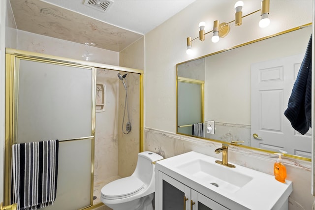 bathroom featuring vanity, visible vents, toilet, tile walls, and a marble finish shower