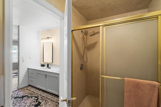 bathroom with vanity and an enclosed shower