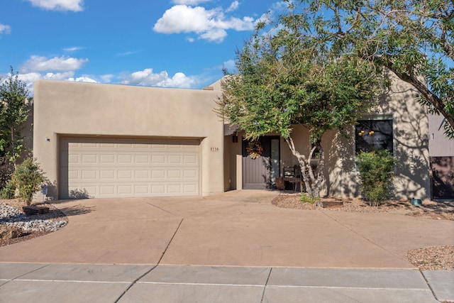 southwest-style home with a garage