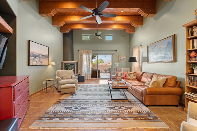 tiled living room with wood ceiling, beam ceiling, and ceiling fan