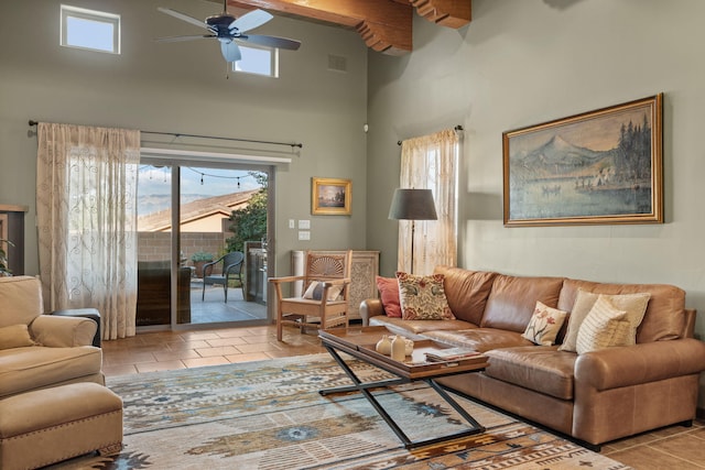 living room with ceiling fan, a wealth of natural light, and light tile patterned flooring