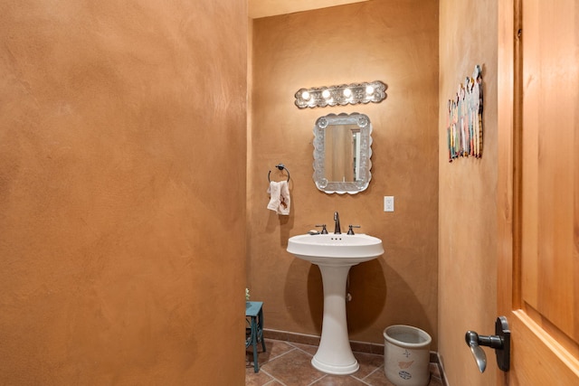 bathroom with tile patterned flooring