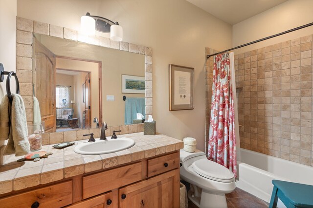 full bathroom with vanity, toilet, tile patterned floors, and shower / bath combo with shower curtain