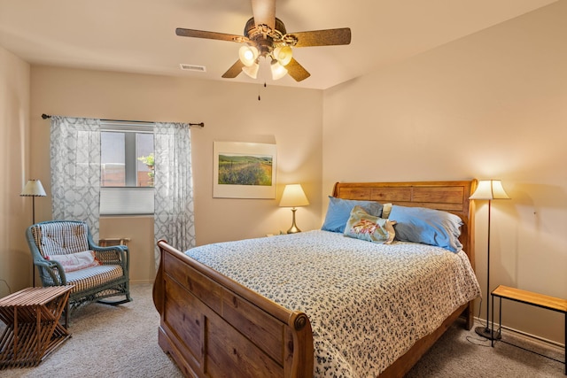 bedroom featuring ceiling fan and carpet