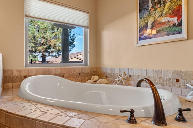 bathroom with a wealth of natural light and a relaxing tiled tub