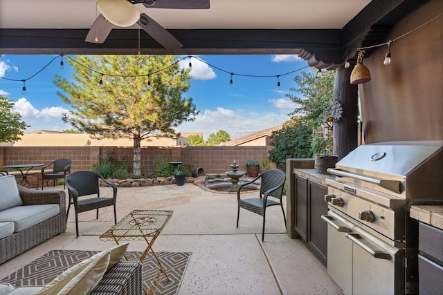 view of patio / terrace with grilling area, an outdoor living space, area for grilling, and ceiling fan