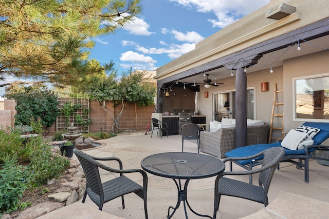 view of patio featuring grilling area and ceiling fan