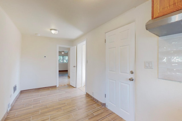 spare room featuring ceiling fan and light hardwood / wood-style floors