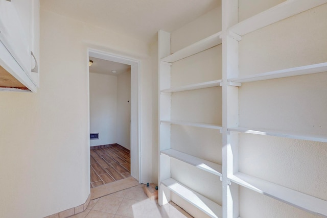 hall with light hardwood / wood-style flooring