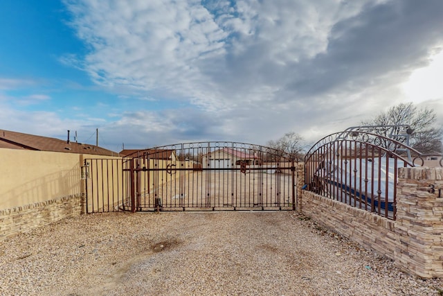 view of gate featuring fence
