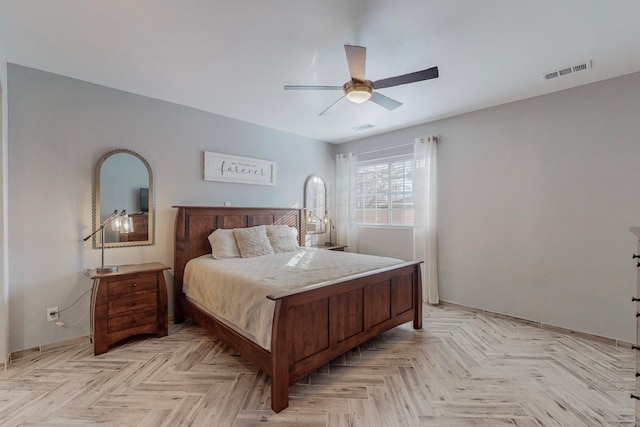 bedroom with light parquet floors and ceiling fan