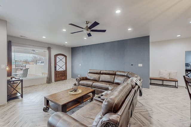 living area with visible vents, recessed lighting, and ceiling fan