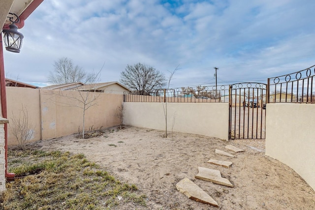 view of yard with a gate and fence private yard