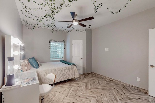 bedroom with light parquet flooring and ceiling fan