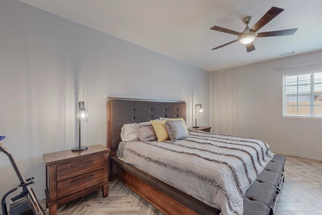 bedroom featuring ceiling fan and light parquet floors