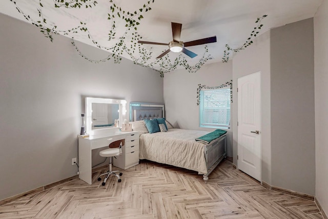 bedroom with light parquet floors and ceiling fan