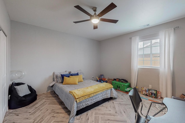 bedroom featuring light parquet floors and ceiling fan