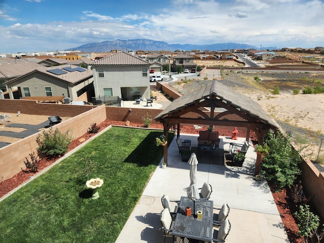 exterior space featuring a residential view and a mountain view