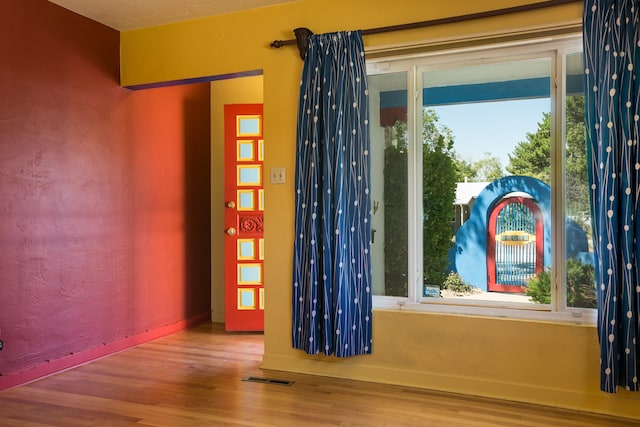 spare room featuring hardwood / wood-style floors