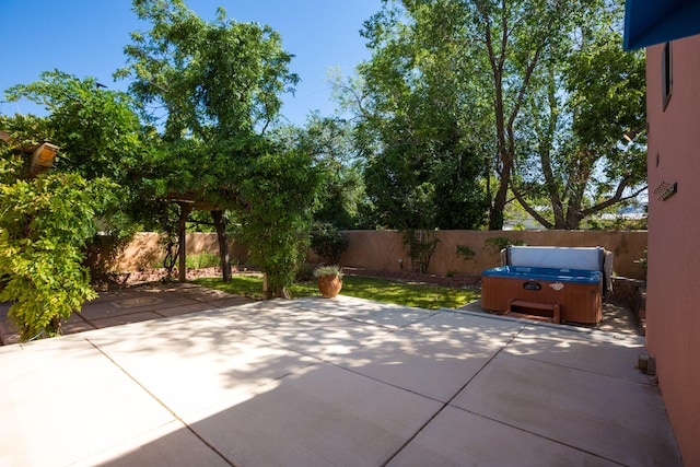 view of patio with a hot tub