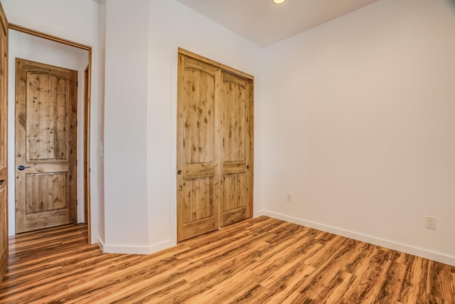 unfurnished bedroom featuring light hardwood / wood-style flooring