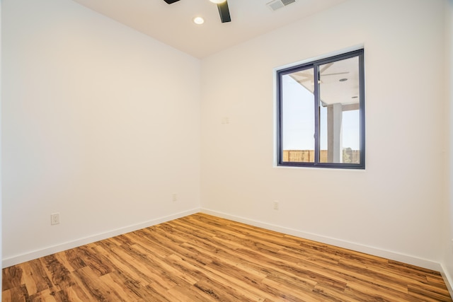 spare room with light hardwood / wood-style flooring and ceiling fan