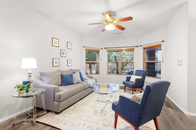 living room with hardwood / wood-style flooring and ceiling fan