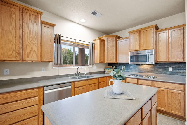 kitchen featuring light tile patterned floors, stainless steel appliances, tasteful backsplash, and sink