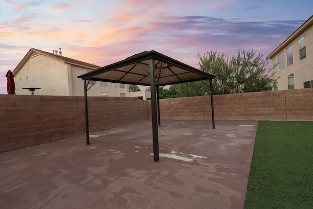 view of patio terrace at dusk